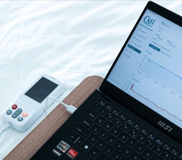 CMI Health CH-100 Pulse Oximeter connected to laptop displaying SpO2 and pulse rate data on CMI Health’s reporting dashboard