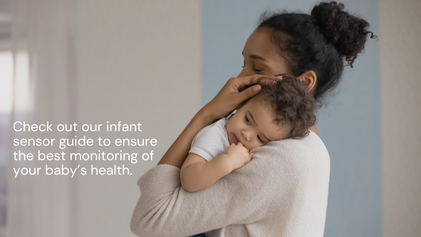 A mother lovingly holds her baby close to her chest.