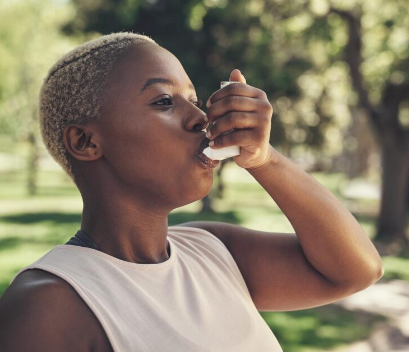 A woman uses her digital spirometer to take a breathing test